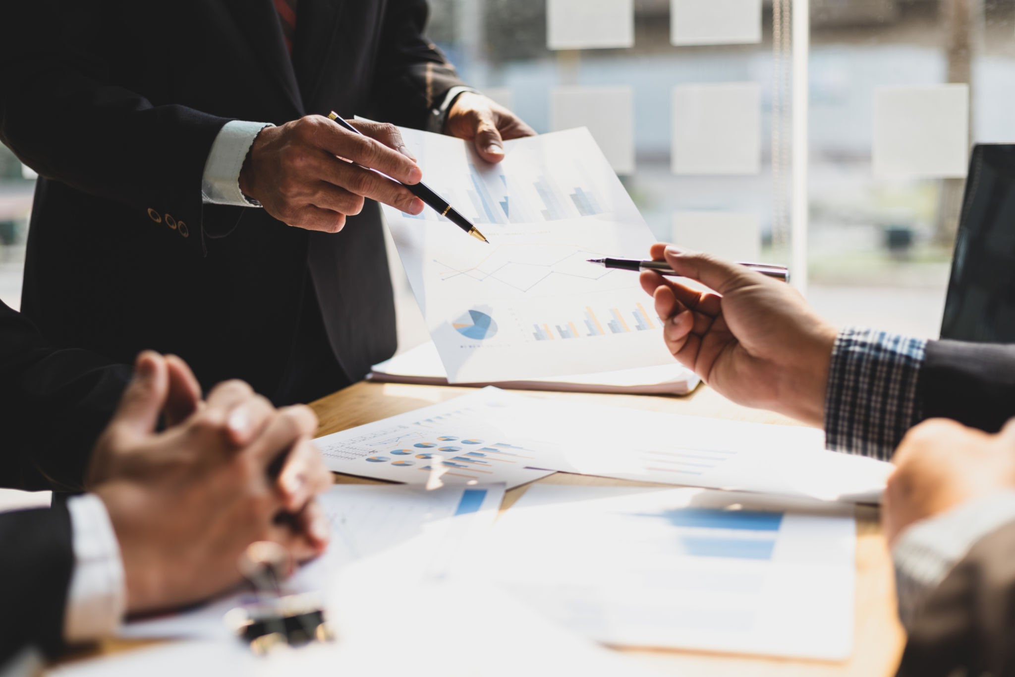 licensed-image Business consulting meetings discuss financial chart analysis and investment strategy planning. Financial planning and accounting.